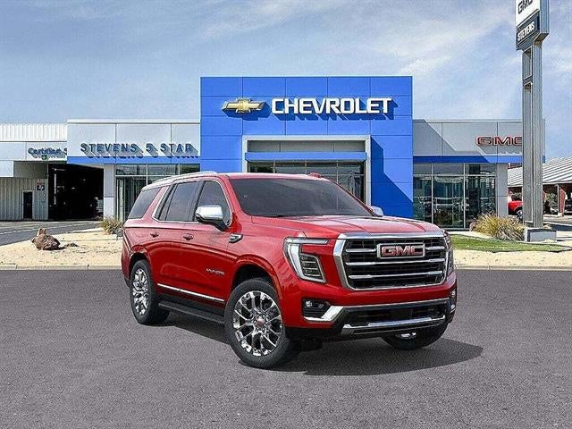 2026 GMC Yukon Elevation in Volcanic Red Tintcoat — front three-quarter view